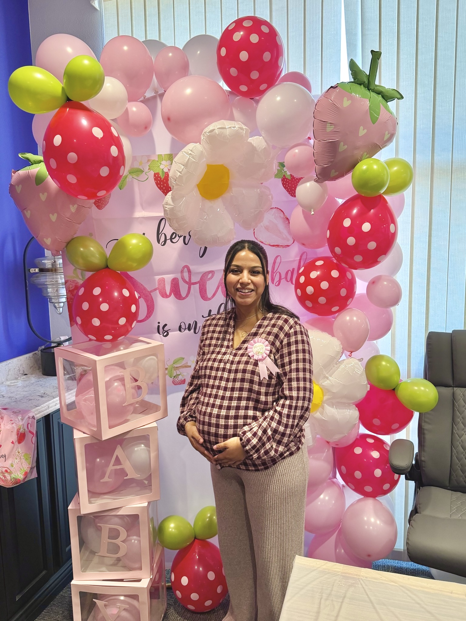 Winder Law Firm employee Angi celebrating her upcoming journey into motherhood