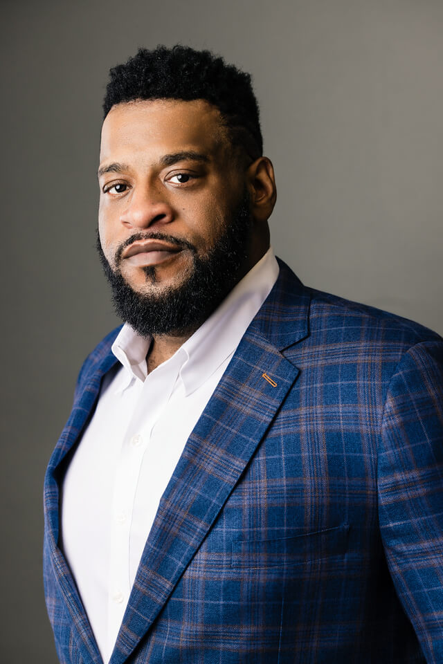 Attorney Aaron A. Winder in a Plaid Jacket